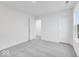 Bedroom featuring soft carpet, ample natural light, and two closets at 1082 Stubble Run, Danville, IN 46122