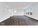 Bright living room featuring gray floors, neutral walls, and large windows that fill the room with light at 1082 Stubble Run, Danville, IN 46122