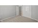 Bedroom with neutral carpet, light grey walls, an interior door and a double door closet at 16689 Cattle Hollow Ln, Noblesville, IN 46060