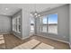 Bright dining area featuring large windows and modern lighting at 16689 Cattle Hollow Ln, Noblesville, IN 46060