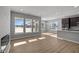 Spacious open-concept living area with large windows and a modern fireplace at 16689 Cattle Hollow Ln, Noblesville, IN 46060