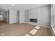 Spacious living room with a modern fireplace, recessed lighting, and wood-look floors at 16689 Cattle Hollow Ln, Noblesville, IN 46060