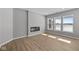 Cozy living room with modern fireplace and large windows at 16689 Cattle Hollow Ln, Noblesville, IN 46060