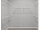 This walk-in closet has neutral carpet and wire shelving on all walls at 16689 Cattle Hollow Ln, Noblesville, IN 46060
