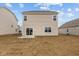 Back of home with sliding glass doors and a small concrete patio at 1837 James Pierce Dr, Shelbyville, IN 46176