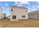 Back of home with sliding glass doors and a small concrete patio at 1837 James Pierce Dr, Shelbyville, IN 46176