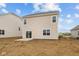 Back of home with sliding glass doors and a small concrete patio at 1837 James Pierce Dr, Shelbyville, IN 46176
