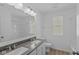 Bathroom features dual sinks, a large mirror, and a shower at 1837 James Pierce Dr, Shelbyville, IN 46176