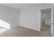 Bright bedroom features neutral carpeting and an open doorway at 1837 James Pierce Dr, Shelbyville, IN 46176