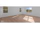 Bright bedroom with luxury vinyl flooring and multiple windows, creating a light and airy atmosphere at 1837 James Pierce Dr, Shelbyville, IN 46176