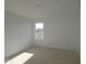 Bright bedroom with large window and light-colored walls at 1837 James Pierce Dr, Shelbyville, IN 46176