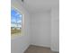 Walk-in closet has a wire shelf for organized storage, carpeted floor, and a bright window at 1837 James Pierce Dr, Shelbyville, IN 46176