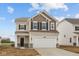 Charming two-story home featuring a two-car garage and stylish neutral color palette at 1837 James Pierce Dr, Shelbyville, IN 46176