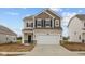 Charming two-story home featuring a two-car garage and stylish neutral color palette at 1837 James Pierce Dr, Shelbyville, IN 46176