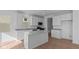 Bright kitchen featuring white cabinetry, stainless steel appliances, large island, and a pantry at 1837 James Pierce Dr, Shelbyville, IN 46176