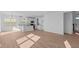 Open-concept living area featuring recessed lighting, wood flooring, and large windows for natural light at 1837 James Pierce Dr, Shelbyville, IN 46176