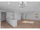 Open-concept living area featuring recessed lighting, wood flooring, and large windows for natural light at 1837 James Pierce Dr, Shelbyville, IN 46176