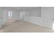 Large living room area with neutral carpet and an open design at 1837 James Pierce Dr, Shelbyville, IN 46176