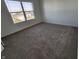 Well-lit bedroom featuring neutral walls, plush carpeting, and a large window at 3211 W Keepsake Ln, Monrovia, IN 46157