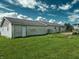 Exterior view of a house featuring a well-maintained backyard and deck with stairs at 4726 E 210 N, Lebanon, IN 46052