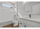 Modern bathroom with white cabinetry, countertop, black hardware, and a tub and shower combination at 5006 Carmine St, Brownsburg, IN 46112
