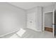 This empty carpeted bedroom features a closet and an open doorway to another room at 5006 Carmine St, Brownsburg, IN 46112