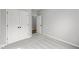 This empty carpeted bedroom features a closet and an open doorway to another room at 5006 Carmine St, Brownsburg, IN 46112
