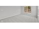 A well-lit bedroom offers neutral carpeting and a bright window view at 5006 Carmine St, Brownsburg, IN 46112