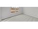 This empty bedroom with carpet features a large window with a view of the outdoors at 5006 Carmine St, Brownsburg, IN 46112