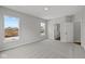 Carpeted bedroom features two windows and an open doorway to an adjacent room at 5006 Carmine St, Brownsburg, IN 46112