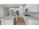 Bright kitchen with white cabinetry, stainless steel appliances, quartz countertops, and modern hardware at 5006 Carmine St, Brownsburg, IN 46112
