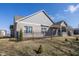 Brick exterior featuring a covered patio and black wrought iron fence in backyard setting at 5677 Starla Ln, Plainfield, IN 46168