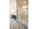 Bright bathroom featuring a glass enclosed shower and vanity with a white countertop at 5677 Starla Ln, Plainfield, IN 46168