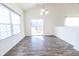 This dining room has wood floors and sliding glass doors that lead to an outdoor deck at 5677 Starla Ln, Plainfield, IN 46168