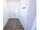 Entryway with hardwood floors, white walls, coat hooks and natural light at 5677 Starla Ln, Plainfield, IN 46168