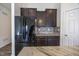Kitchen with stainless steel appliances, marble countertops, and tile backsplash at 5677 Starla Ln, Plainfield, IN 46168