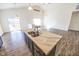 The kitchen island features marble countertops, a stainless steel sink, and dark wood cabinets at 5677 Starla Ln, Plainfield, IN 46168
