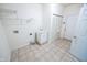 Efficient laundry room with sink, storage cabinet, and washer/dryer hookups at 5677 Starla Ln, Plainfield, IN 46168