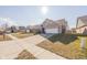 Street view showing a suburban neighborhood with sidewalks, and landscaped yards at 5677 Starla Ln, Plainfield, IN 46168