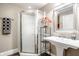 Basement bathroom with a corner shower and pedestal sink at 659 Ellsworth St, Indianapolis, IN 46202