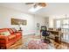 Bright home office features built-in desk, hardwood floors, and comfortable seating at 659 Ellsworth St, Indianapolis, IN 46202