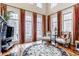 Living room with hardwood floors, fireplace and large windows at 659 Ellsworth St, Indianapolis, IN 46202