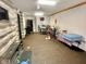 A large room with a bar, tables and chairs, with wall coverings and hard flooring at 1214 N Penn St, Muncie, IN 47303