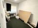 Vacant room with bare white walls, a window, and clutter at 1214 N Penn St, Muncie, IN 47303
