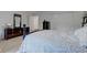 Spacious bedroom featuring metal bed frame, closet and dresser, creating a stylish and comfortable retreat at 2856 Jamieson Ln, Indianapolis, IN 46268