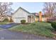 Traditional home with brick and white siding, attached garage, and landscaped front yard at 2856 Jamieson Ln, Indianapolis, IN 46268