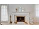 Close up on the fireplace with decorative mantel, mirrors, and accessories at 2856 Jamieson Ln, Indianapolis, IN 46268