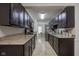 Bright kitchen with stone countertops, tile flooring and black cabinetry at 2856 Jamieson Ln, Indianapolis, IN 46268