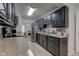 A classic kitchen with granite countertops and sleek black cabinetry at 2856 Jamieson Ln, Indianapolis, IN 46268