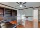 Living room area with hardwood floors, built-in shelving, and comfortable seating at 2856 Jamieson Ln, Indianapolis, IN 46268